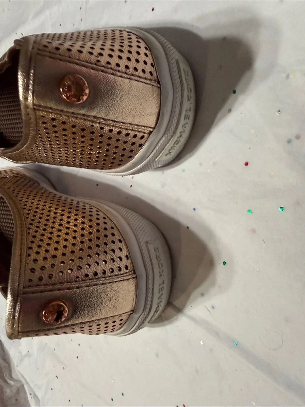 Michael Kors Metallic Rose Gold Perforated Slip-On Sneakers